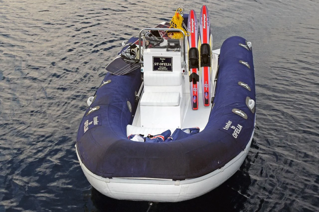 a white and blue snowmobile on a sandy surface aboard OFELIA Yacht for Sale