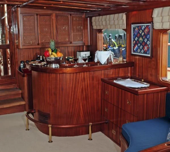 a kitchen with a table and chairs aboard OFELIA Yacht for Sale