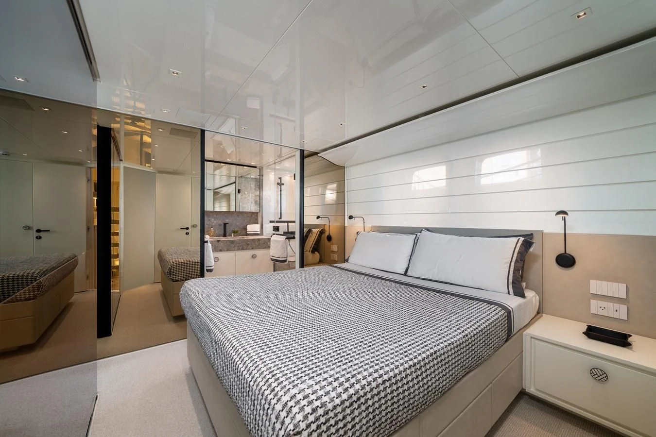 a large bedroom with a large bed aboard ADIOS Yacht for Charter