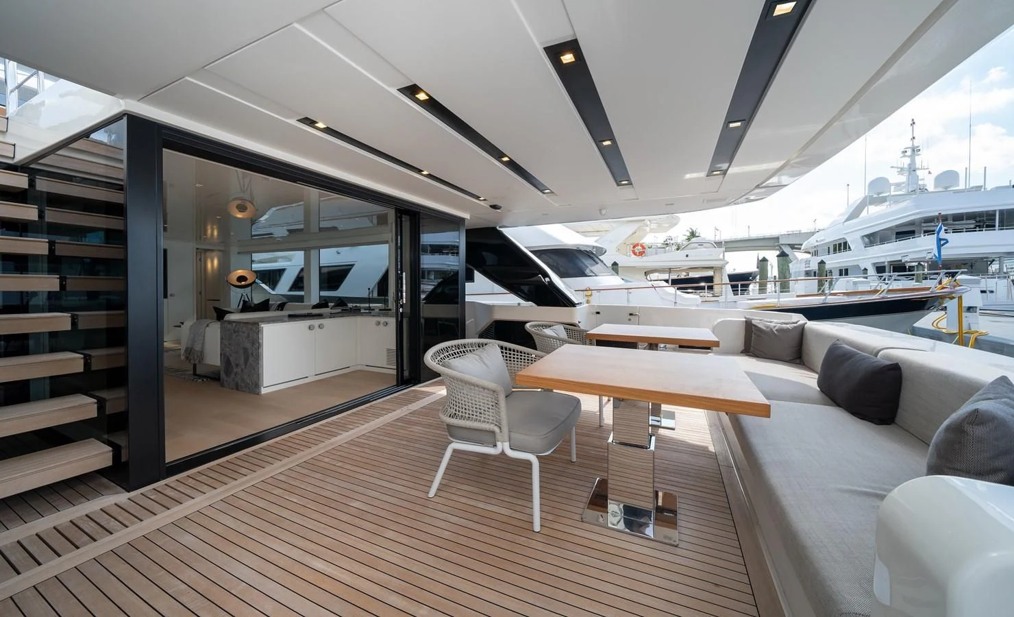 a room with a couch and a table and chairs aboard ADIOS Yacht for Charter
