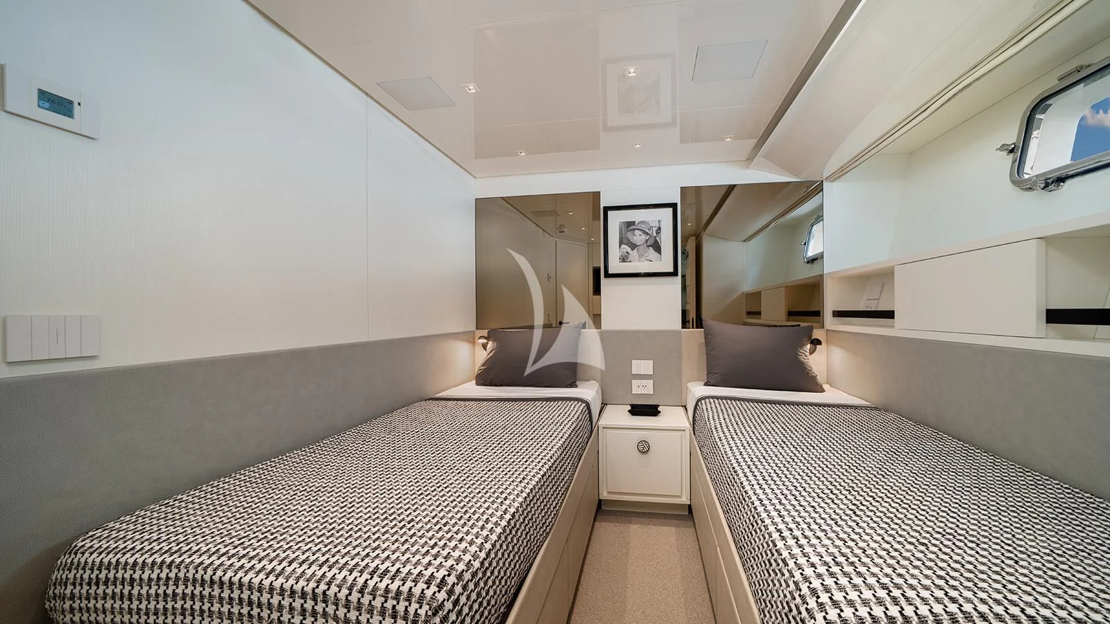 a room with two beds aboard ADIOS Yacht for Charter