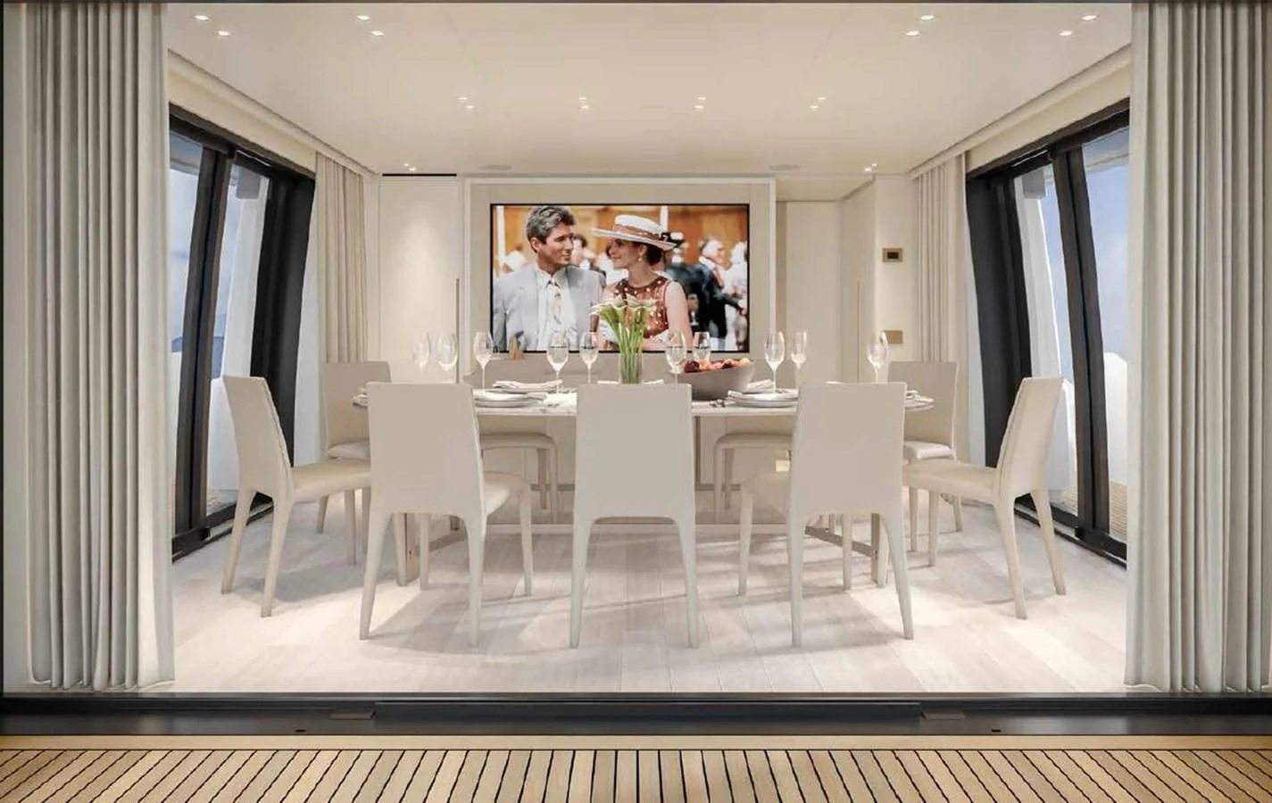 a group of people sitting at a table aboard ADIOS Yacht for Charter