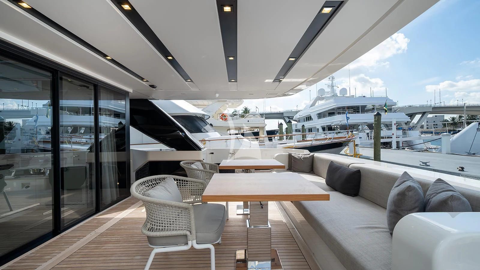 a room with a couch and a table and chairs aboard ADIOS Yacht for Charter