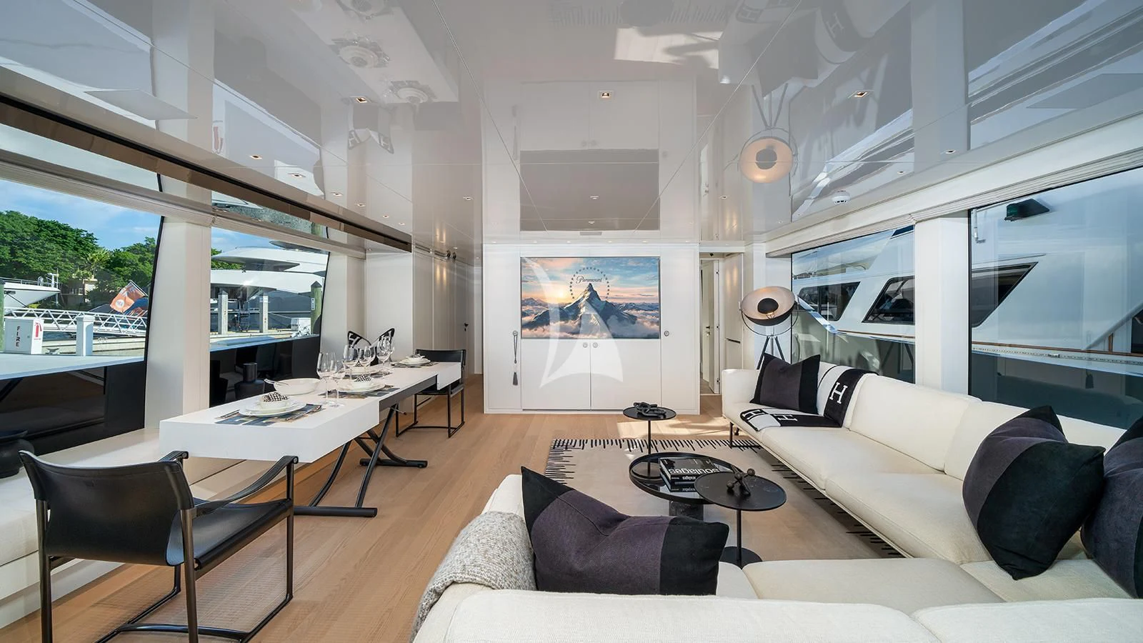 a living room with a large window aboard ADIOS Yacht for Charter