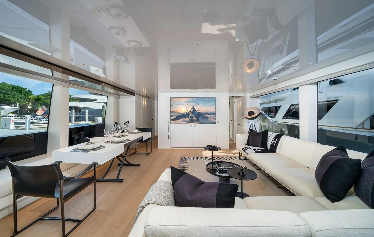 a living room with a large window aboard ADIOS Yacht for Charter