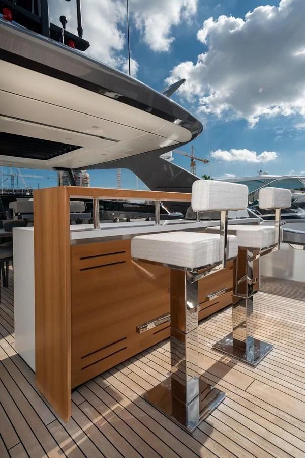 a wooden boat on a deck aboard ADIOS Yacht for Charter
