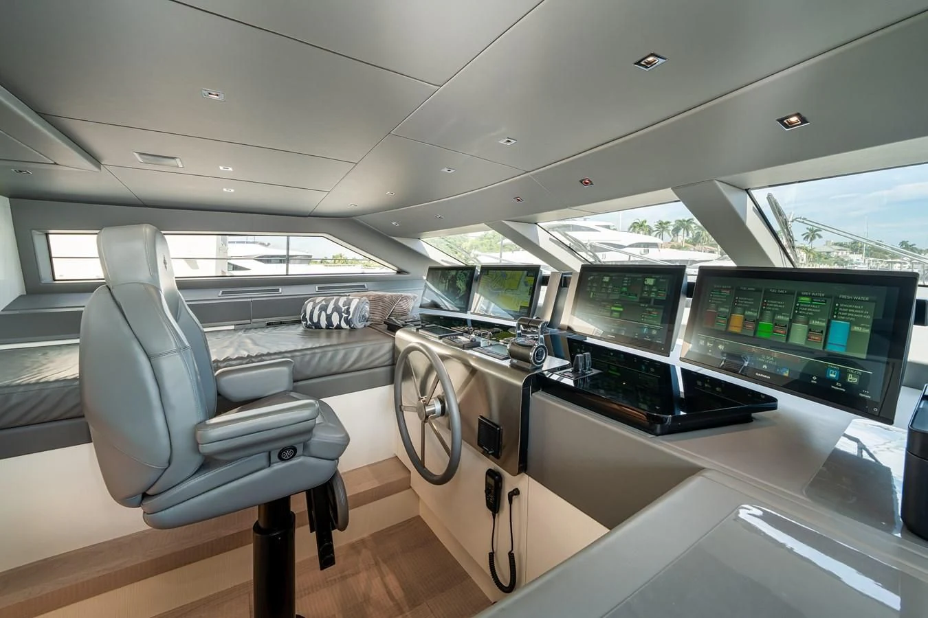 a room with a desk and chairs aboard ADIOS Yacht for Charter