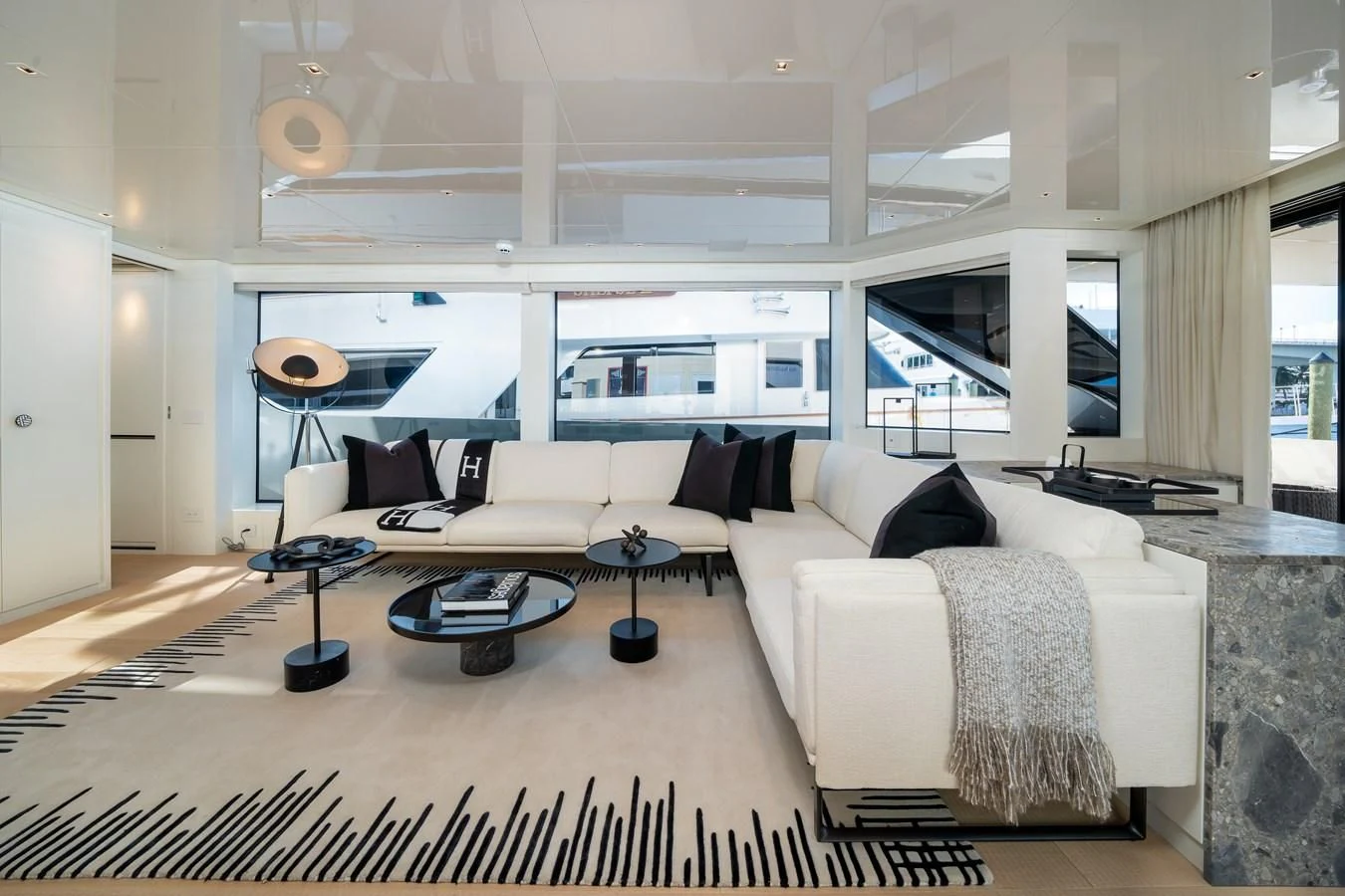 a room with a bed and a table aboard ADIOS Yacht for Charter