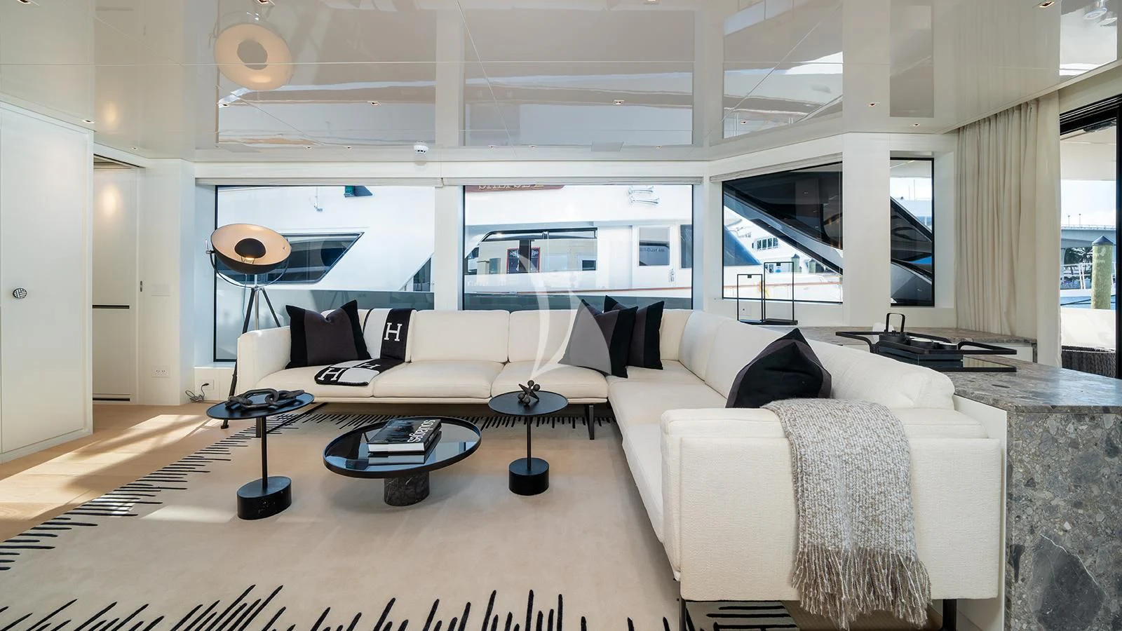 a room with a couch and a table aboard ADIOS Yacht for Charter