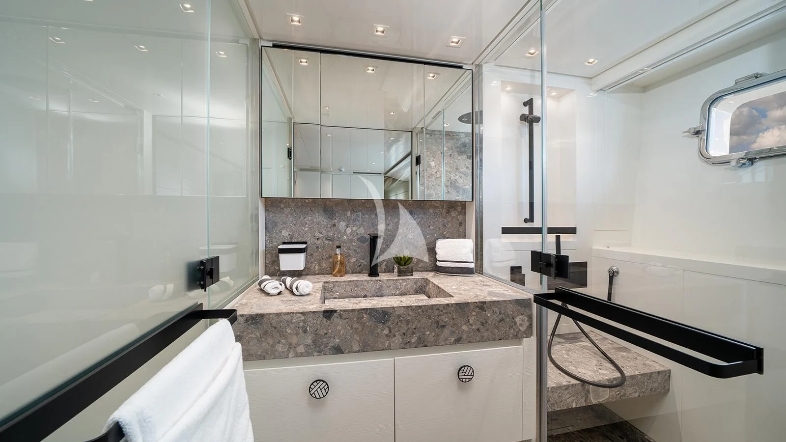 a bathroom with a marble countertop aboard ADIOS Yacht for Charter