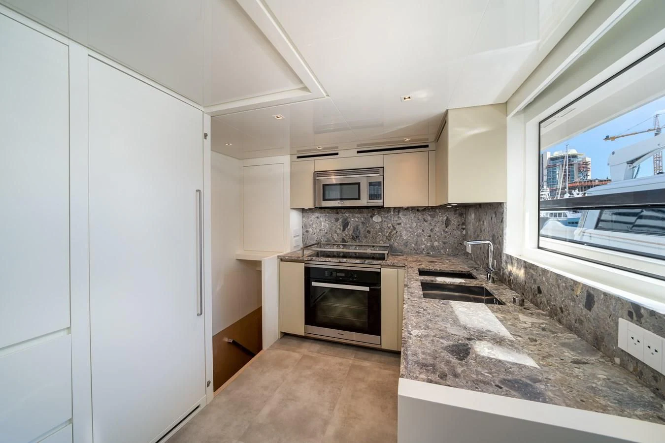 a kitchen with a marble counter top aboard ADIOS Yacht for Charter