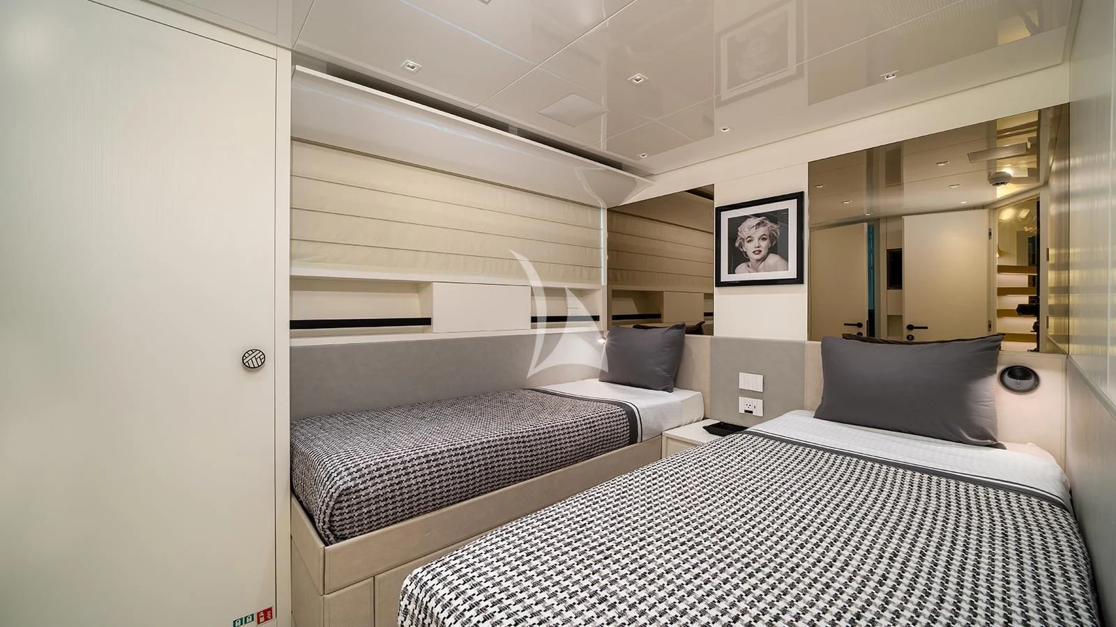 a couple of beds in a room aboard ADIOS Yacht for Charter