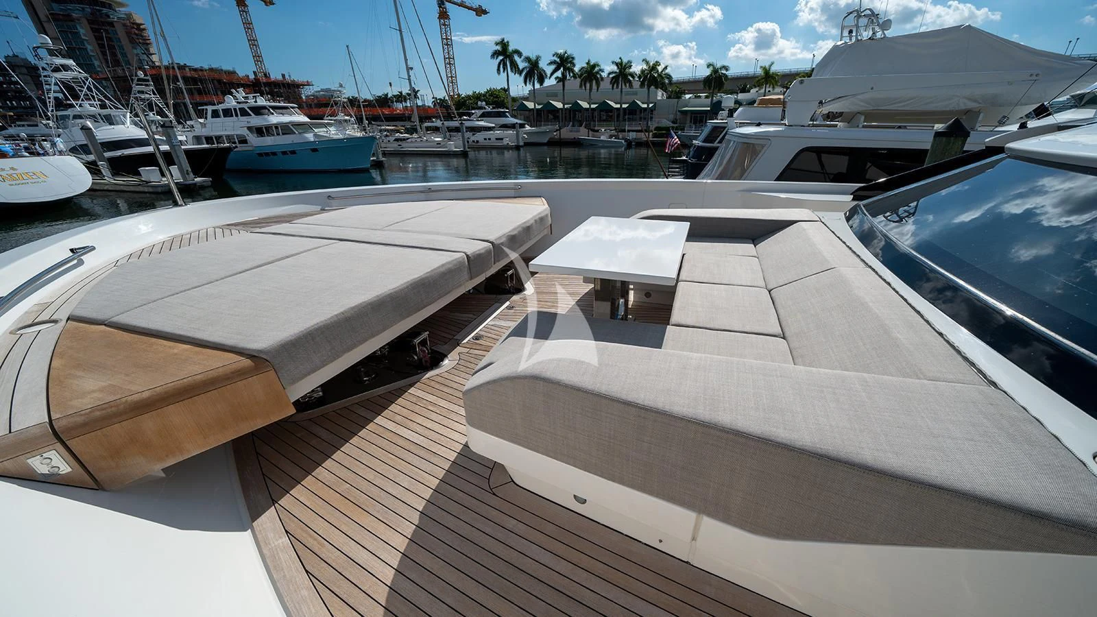 a deck with boats and a beach aboard ADIOS Yacht for Charter