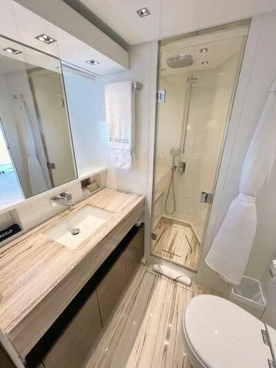 a bathroom with a sink and a shower aboard C-DAZE Yacht for Sale