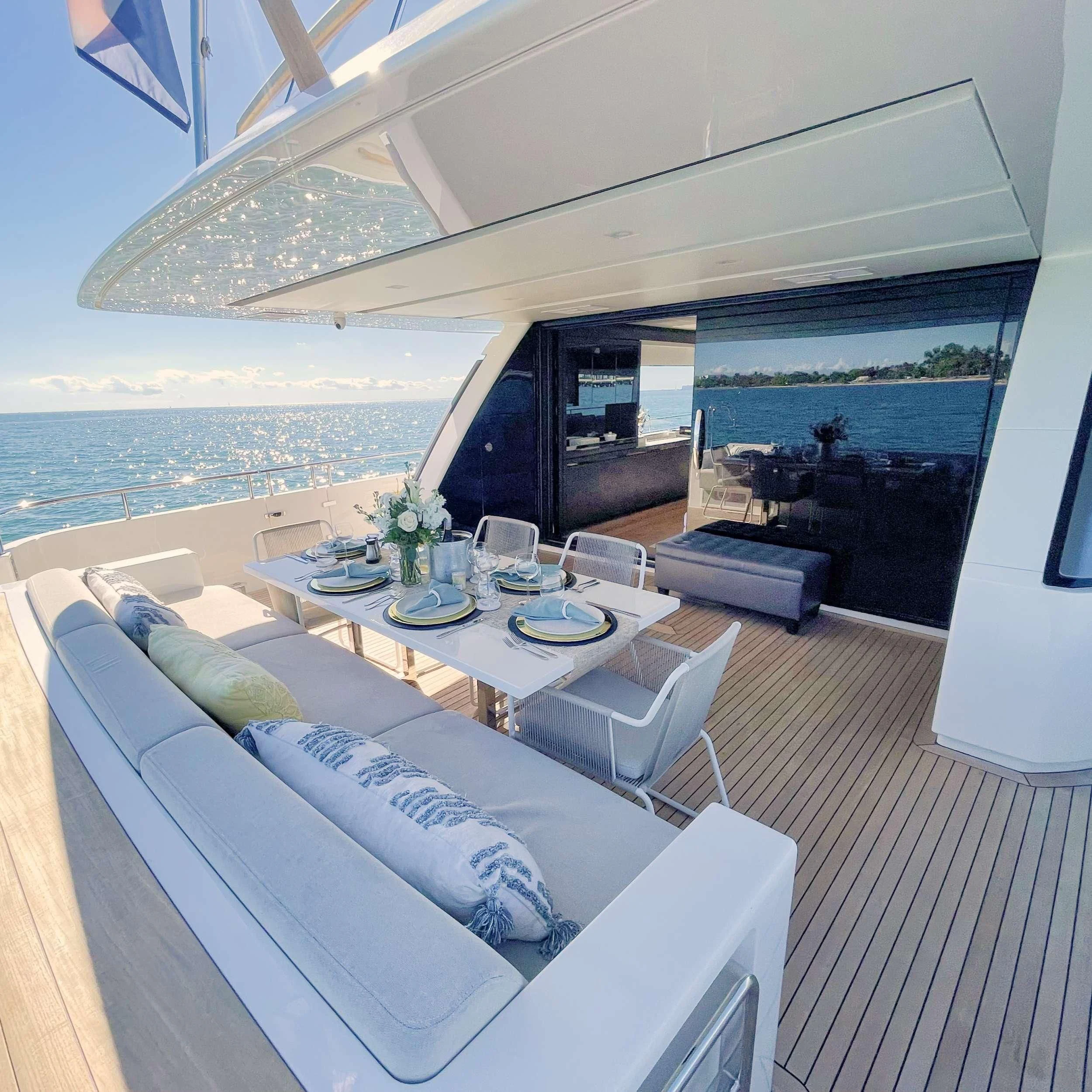 a modern living room with a large body of water aboard C-DAZE Yacht for Sale