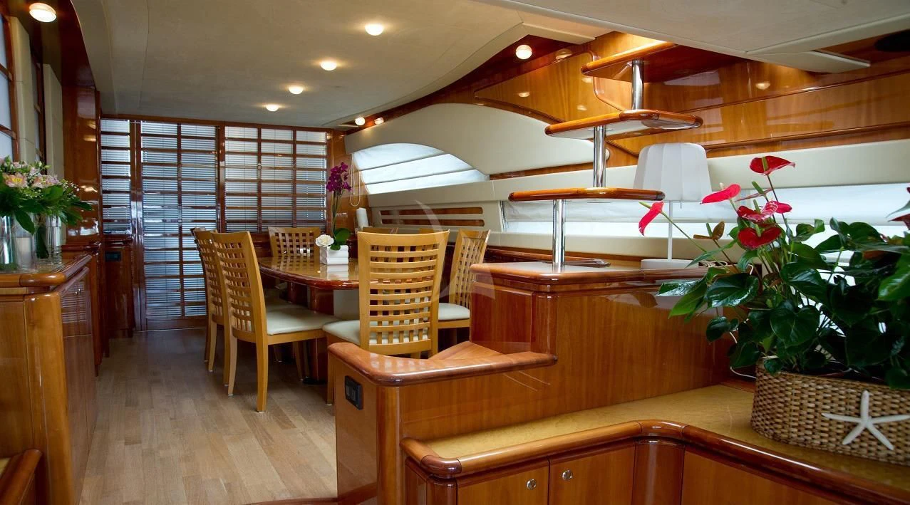 a room with a table and chairs aboard PAMPERO Yacht for Charter