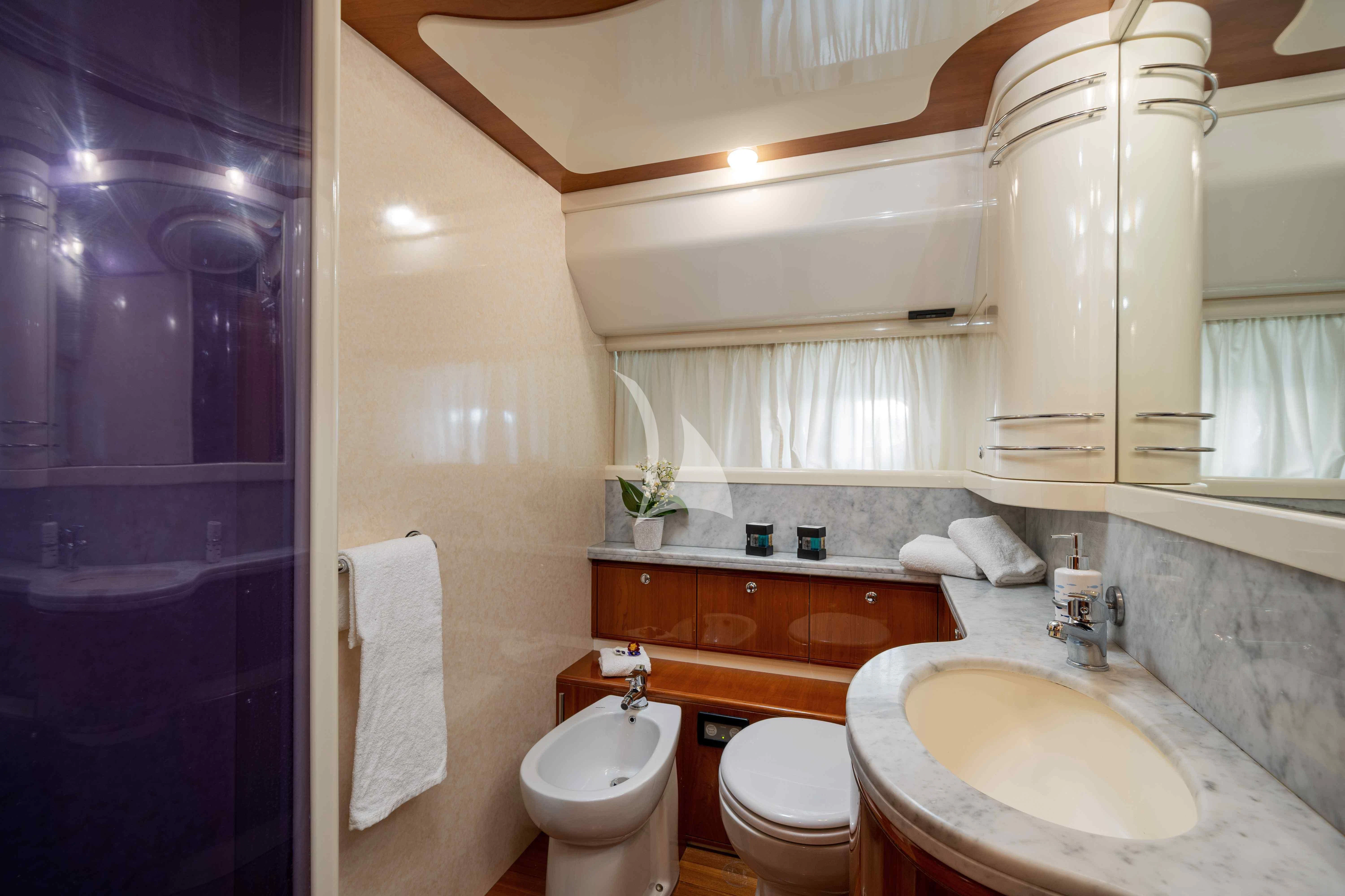 a bathroom with a sink toilet and a bathtub aboard PAMPERO Yacht for Charter