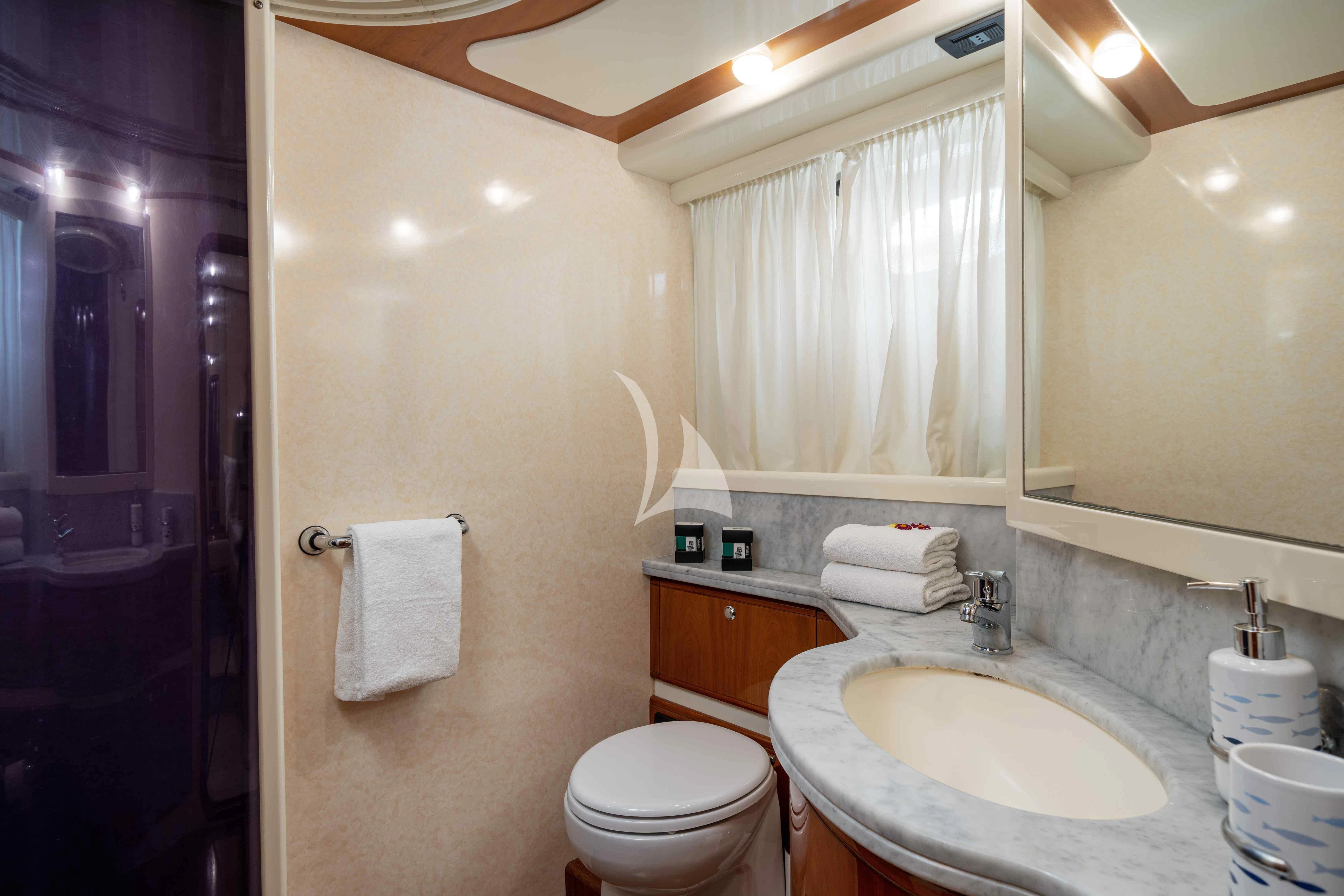 a bathroom with a sink and toilet aboard PAMPERO Yacht for Charter