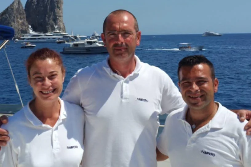 a group of men on a boat aboard PAMPERO Yacht for Charter