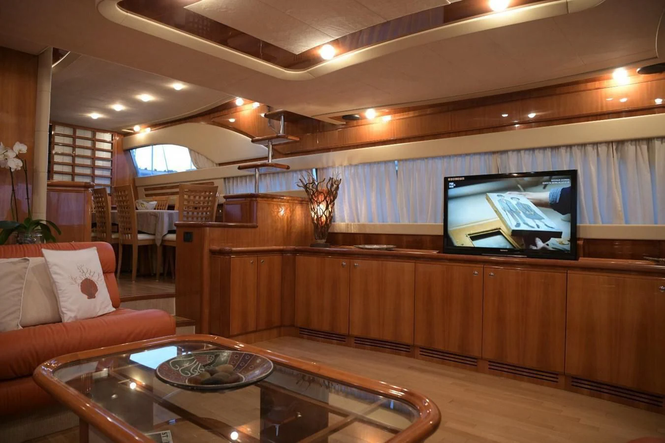 a room with a table and couch aboard PAMPERO Yacht for Charter