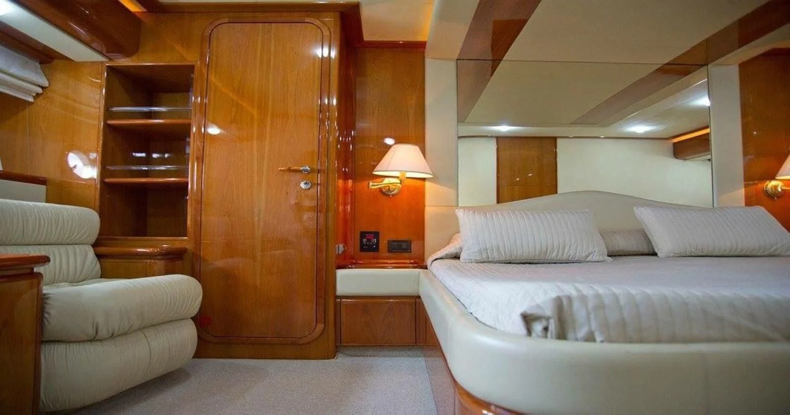 a room with a bed and a couch aboard PAMPERO Yacht for Charter