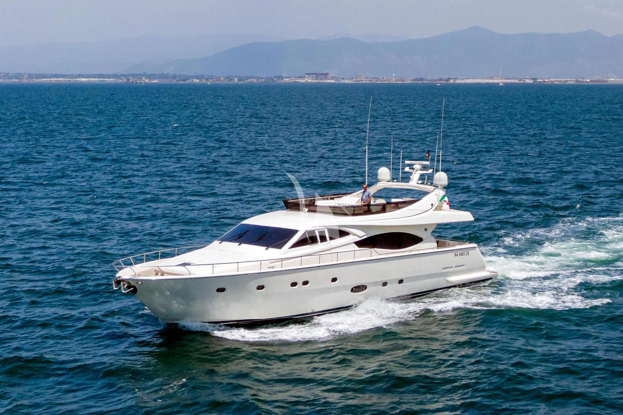 a white boat on the water aboard PAMPERO Yacht for Charter