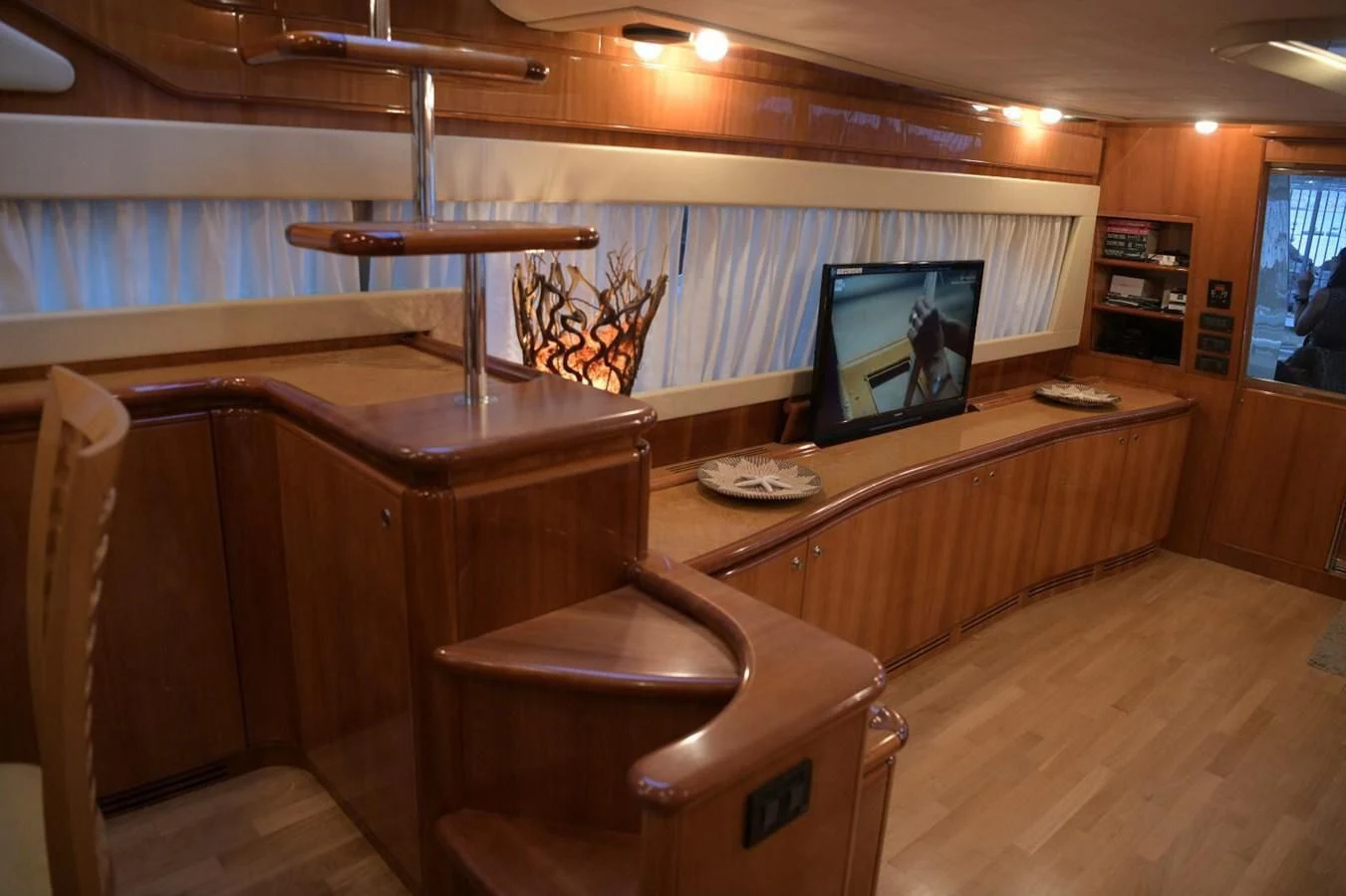 a room with a desk and a tv aboard PAMPERO Yacht for Charter