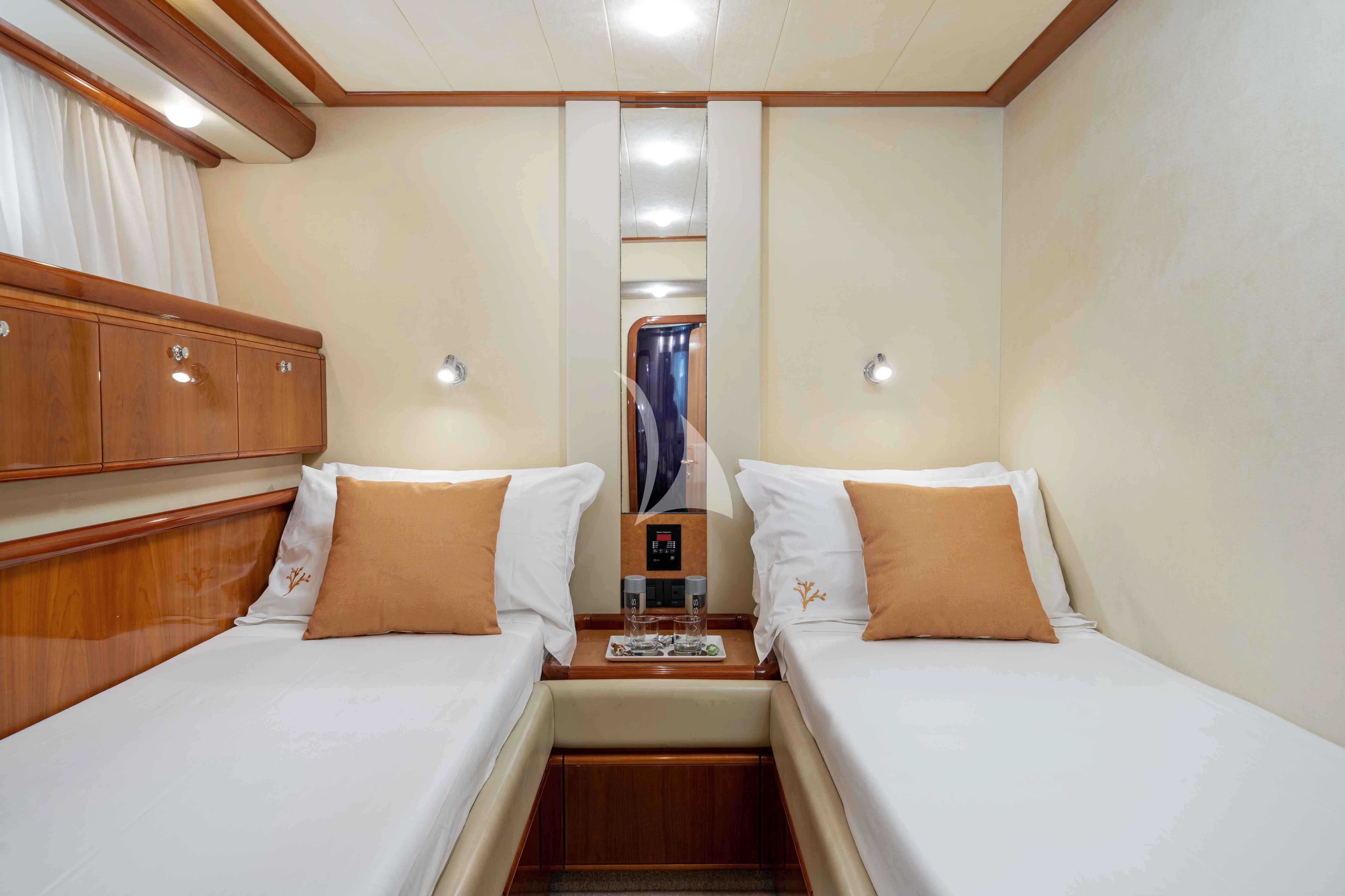 a room with two beds aboard PAMPERO Yacht for Charter