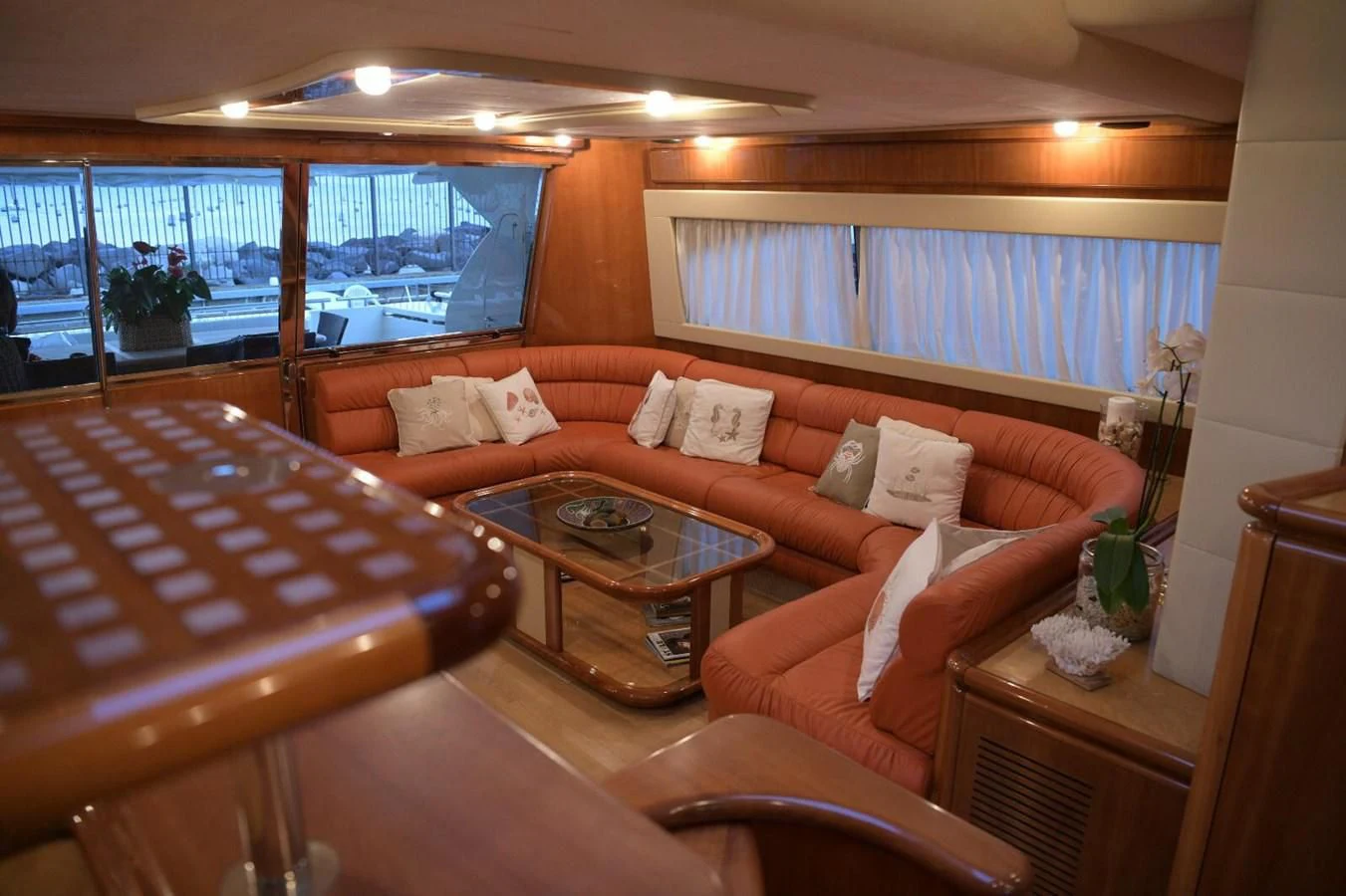 a living room with a piano aboard PAMPERO Yacht for Charter