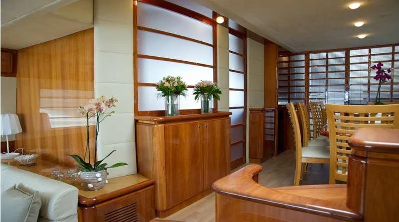a room with a table and chairs aboard PAMPERO Yacht for Charter