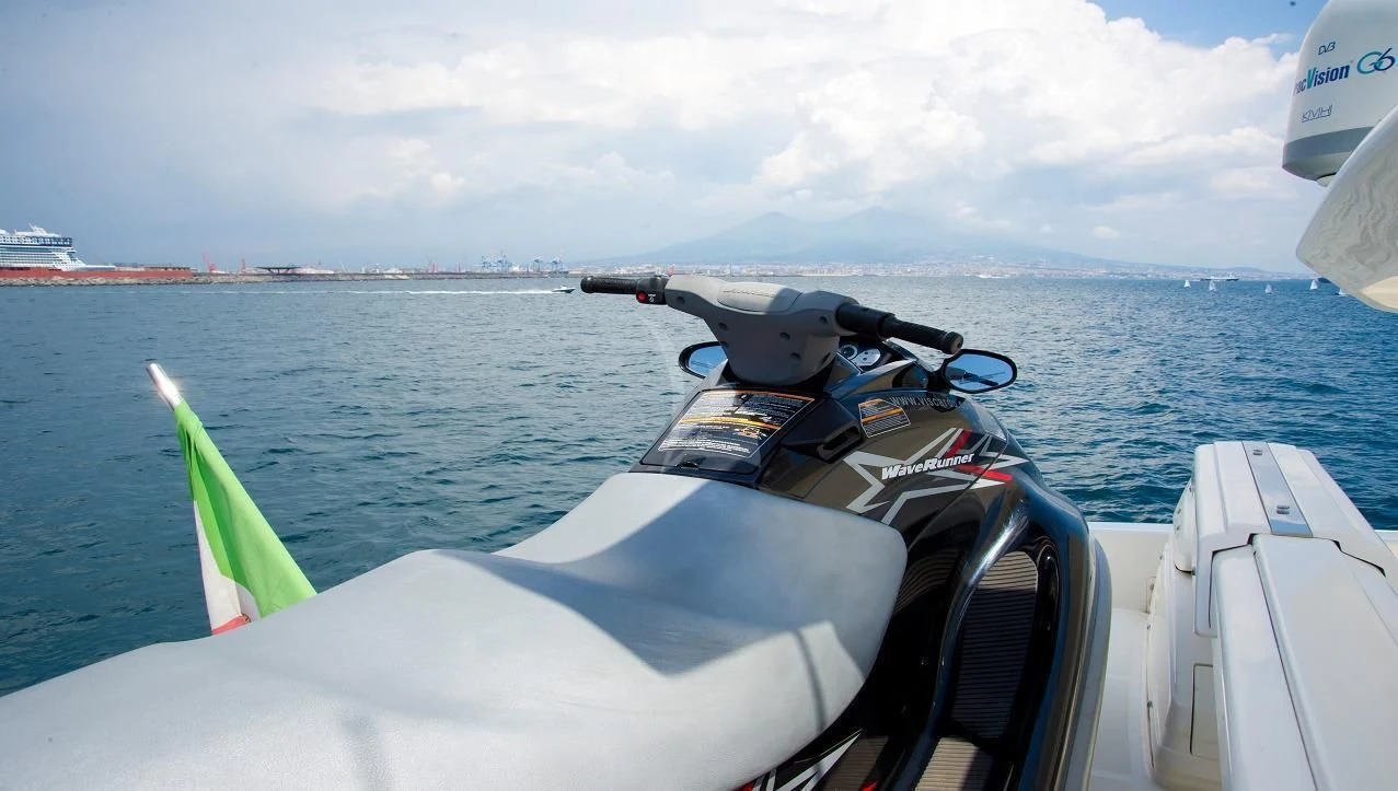 a boat with a flag on the front aboard PAMPERO Yacht for Charter