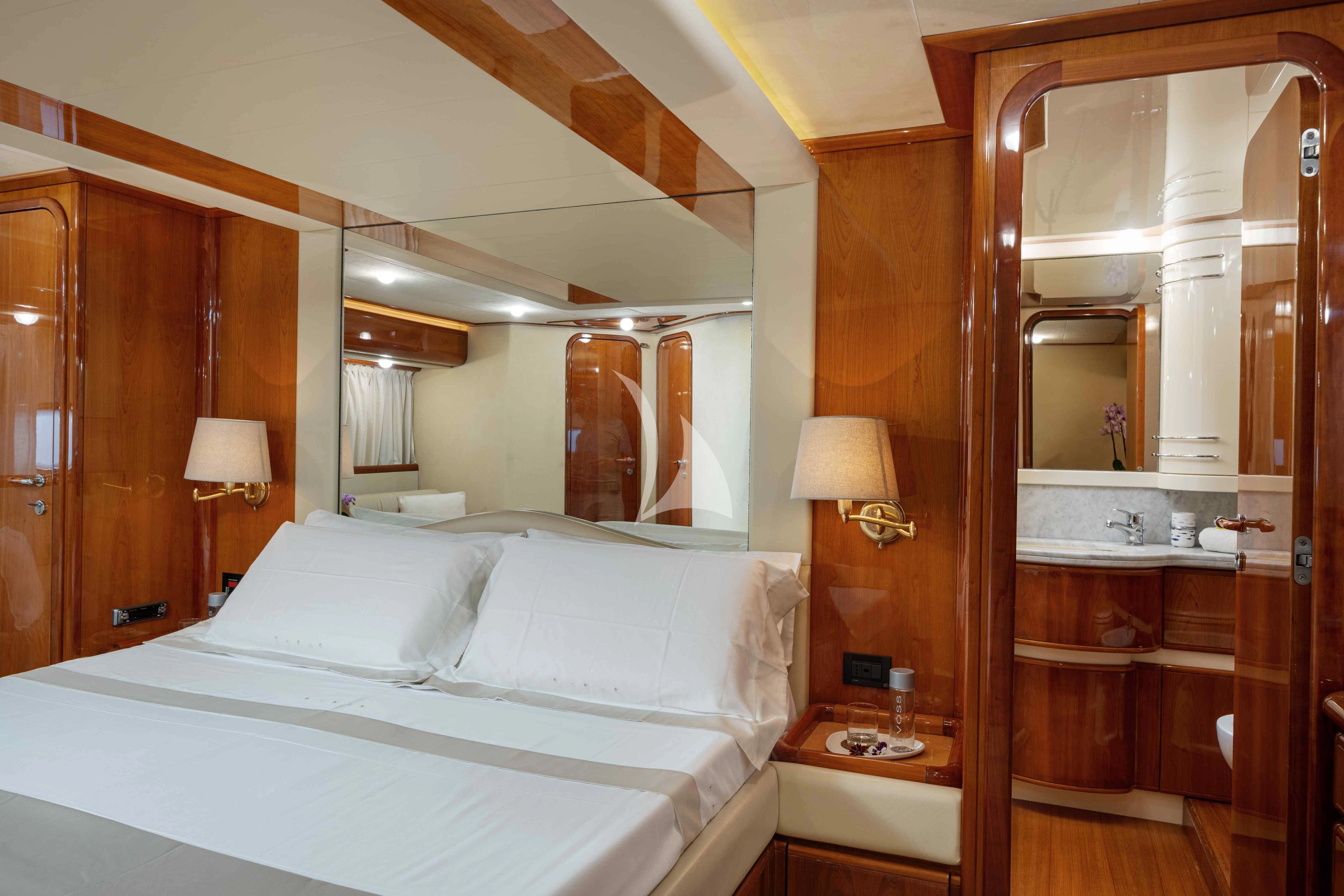 a hotel room with a large mirror aboard PAMPERO Yacht for Charter