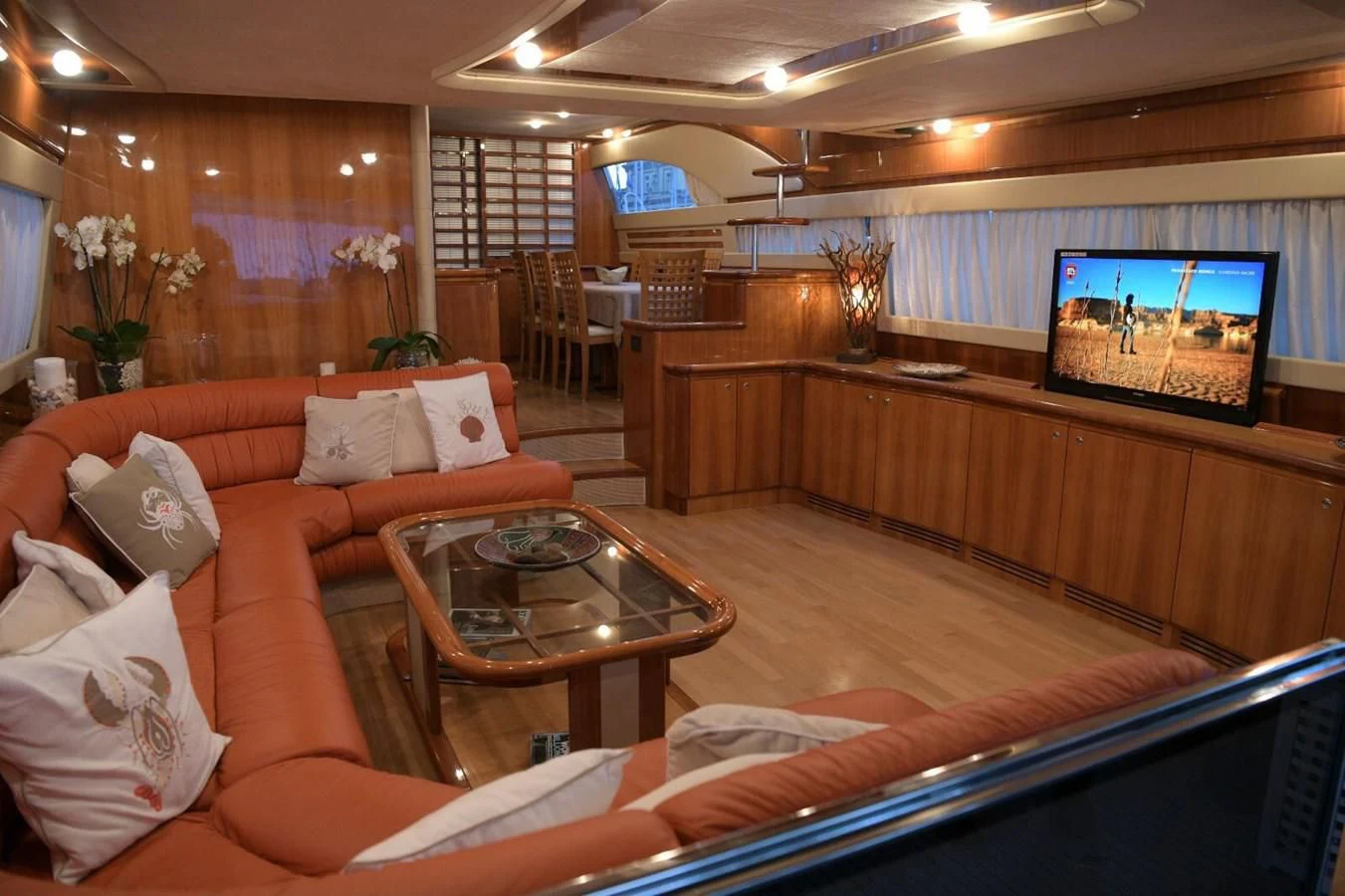 a room with a couch and a table aboard PAMPERO Yacht for Charter