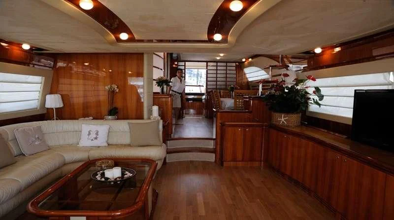 a living room with a wood floor aboard PAMPERO Yacht for Charter