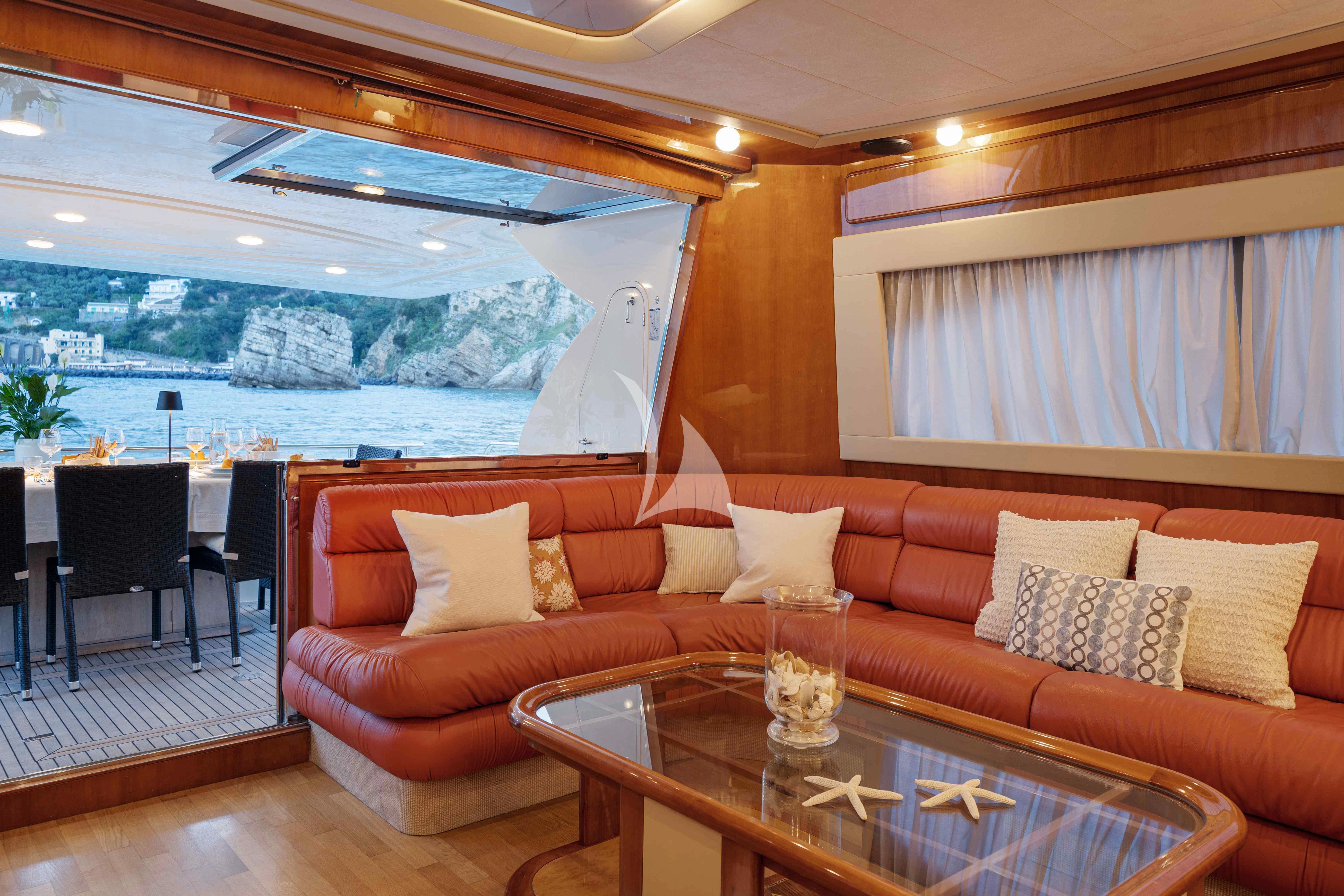 a living room with a large window aboard PAMPERO Yacht for Charter