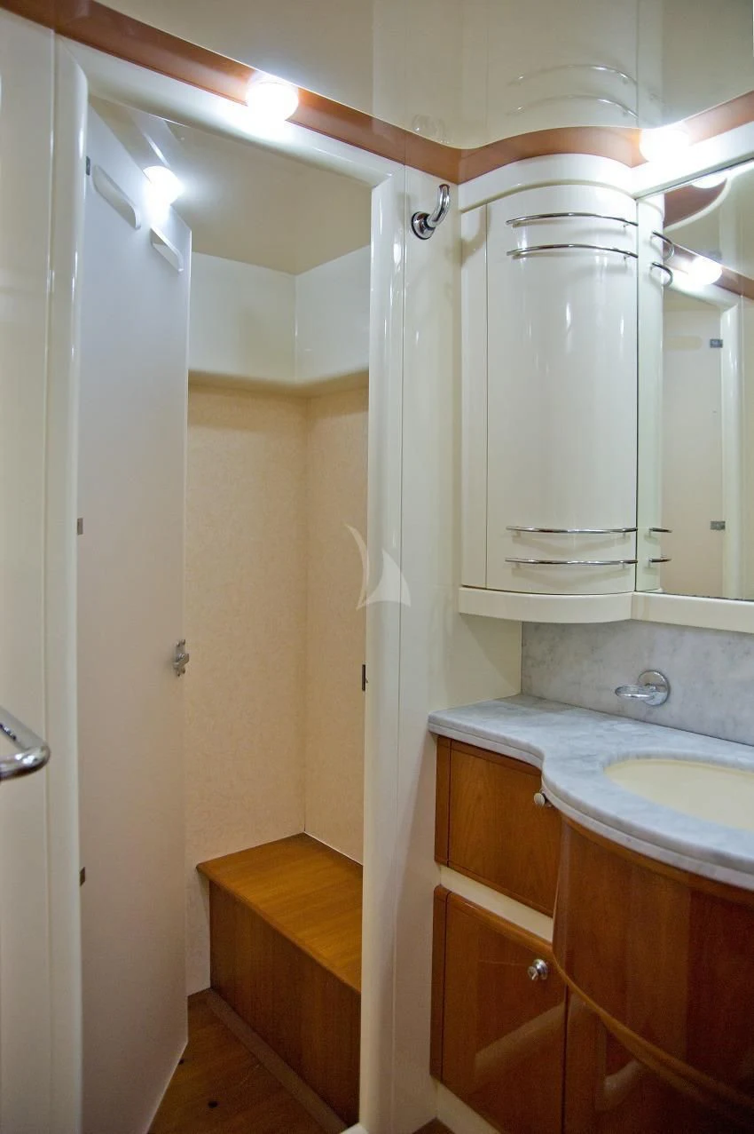 a bathroom with a sink and a mirror aboard PAMPERO Yacht for Charter