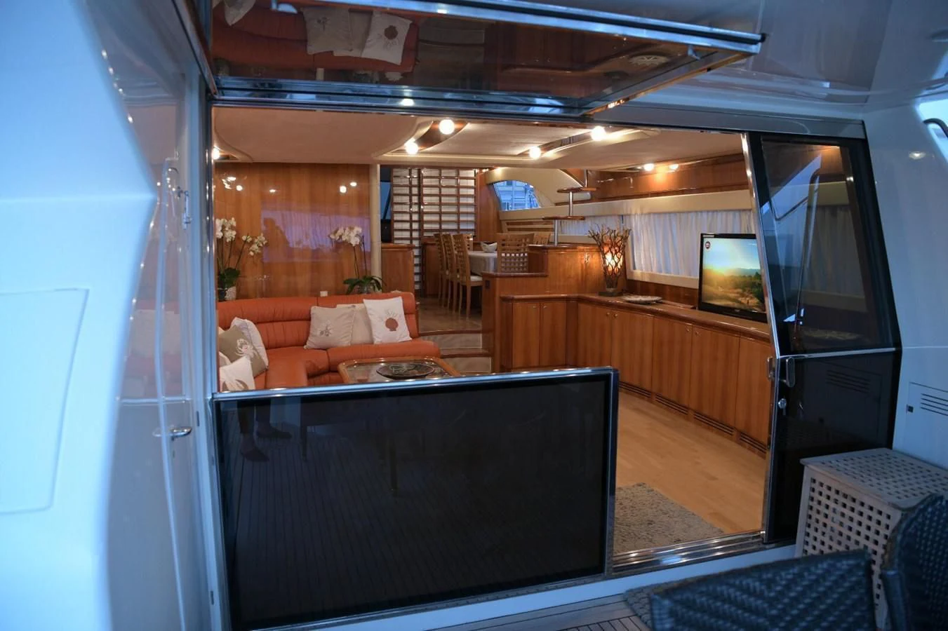 a room with a couch and a tv aboard PAMPERO Yacht for Charter