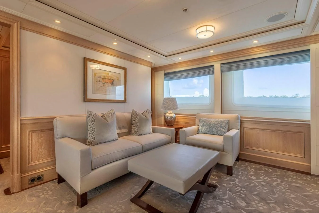 a living room with a couch and a coffee table aboard FABULOUS CHARACTER Yacht for Charter