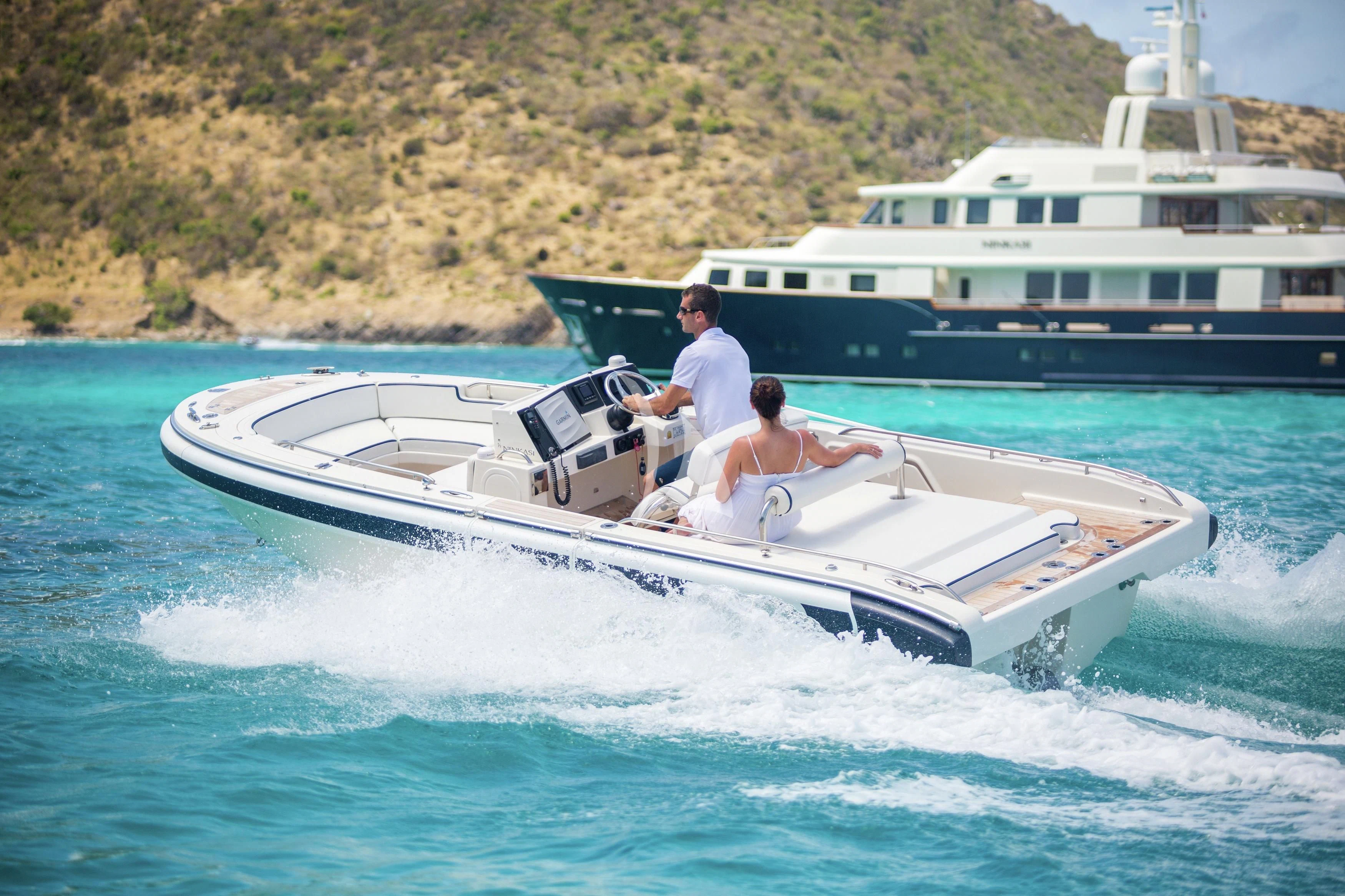 a man and a woman on a speedboat in the water aboard FABULOUS CHARACTER Yacht for Charter