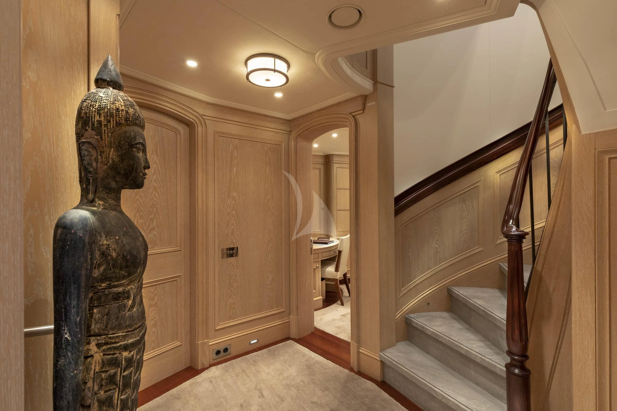 a hallway with a statue aboard FABULOUS CHARACTER Yacht for Charter