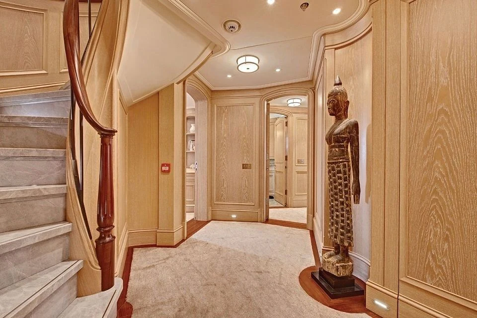 a hallway with a staircase and a staircase aboard FABULOUS CHARACTER Yacht for Charter