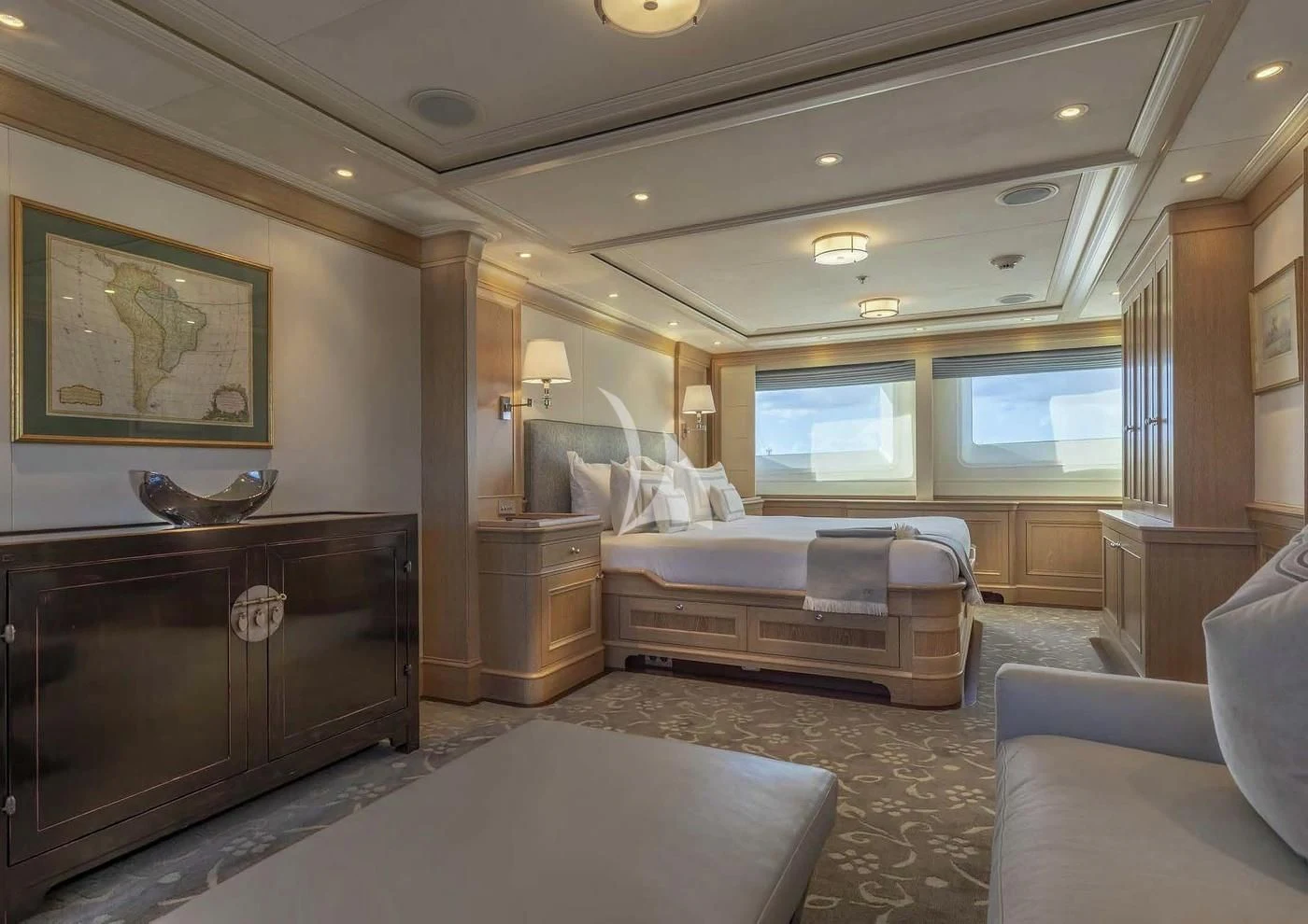 a bedroom with a bed and a large mirror aboard FABULOUS CHARACTER Yacht for Charter