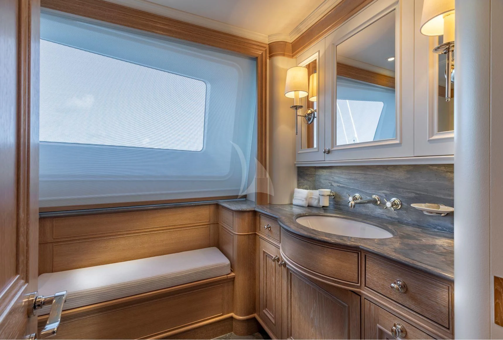 a bathroom with a sink and a mirror aboard FABULOUS CHARACTER Yacht for Charter