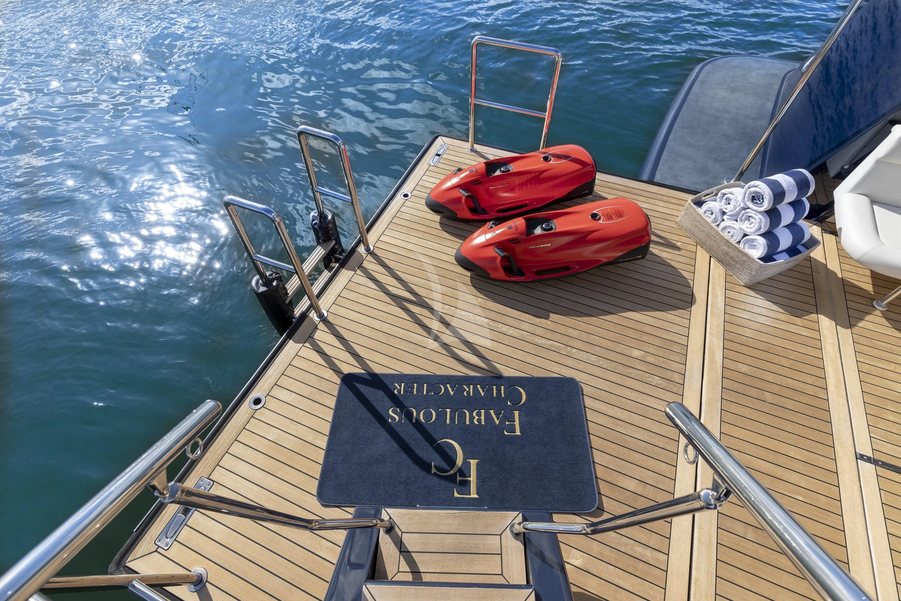 a boat with a red and black paddle on the front aboard FABULOUS CHARACTER Yacht for Charter