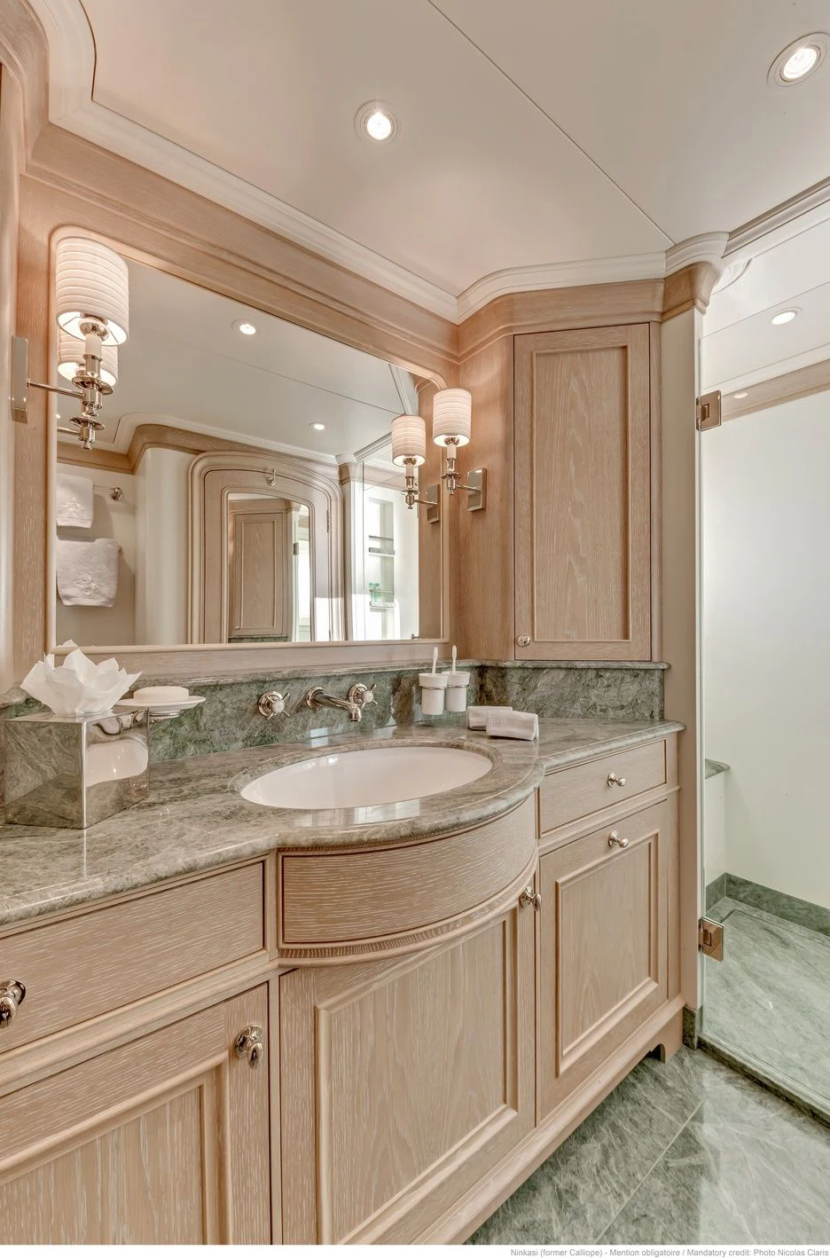 a bathroom with a sink and a mirror aboard FABULOUS CHARACTER Yacht for Charter