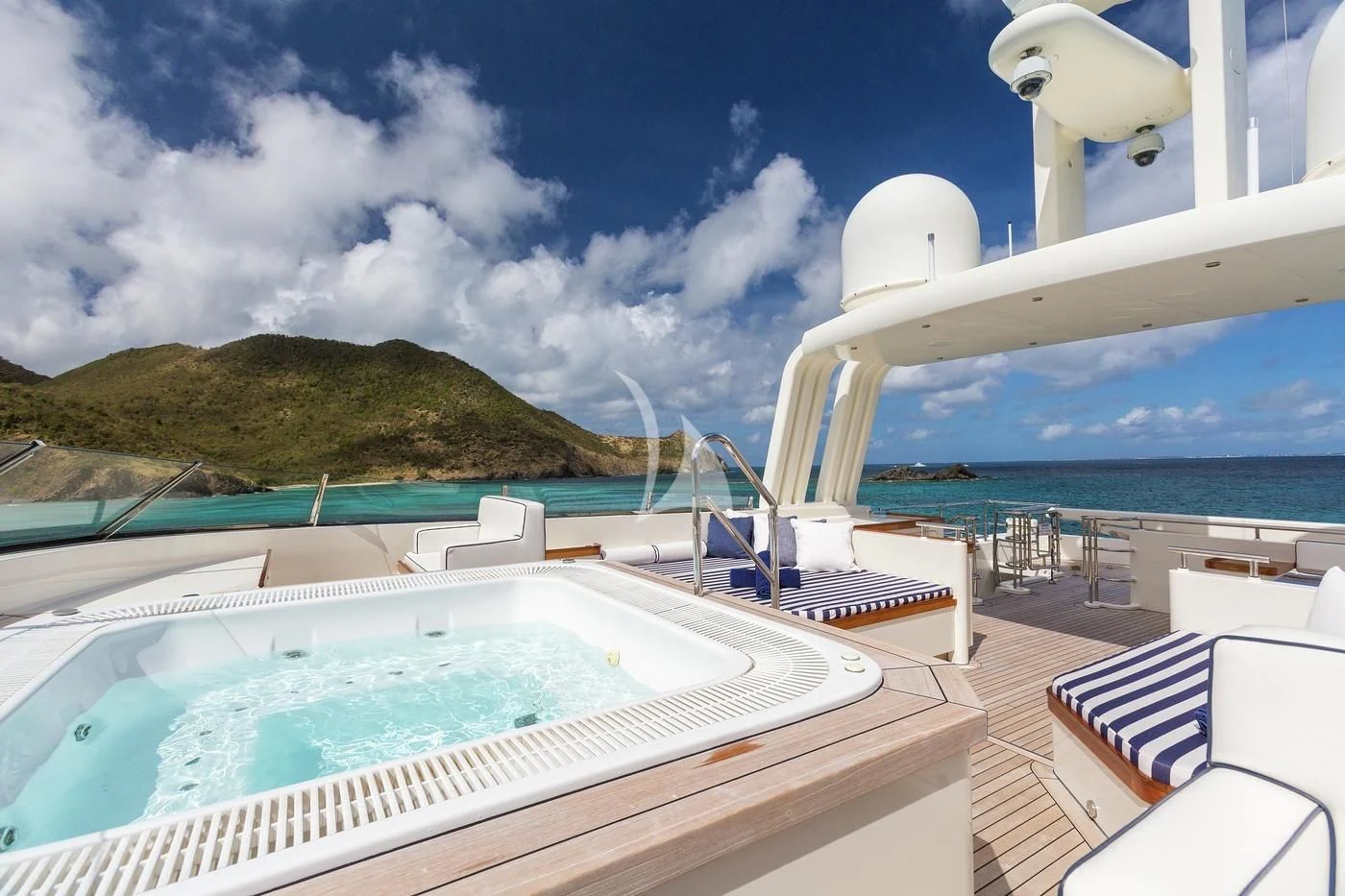 a large white boat on a body of water aboard FABULOUS CHARACTER Yacht for Charter