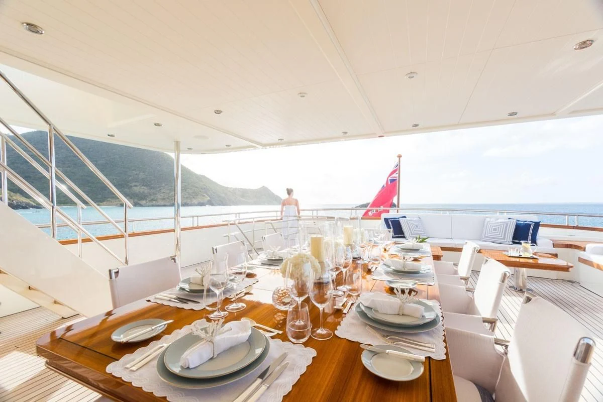a table set for a dinner aboard FABULOUS CHARACTER Yacht for Charter