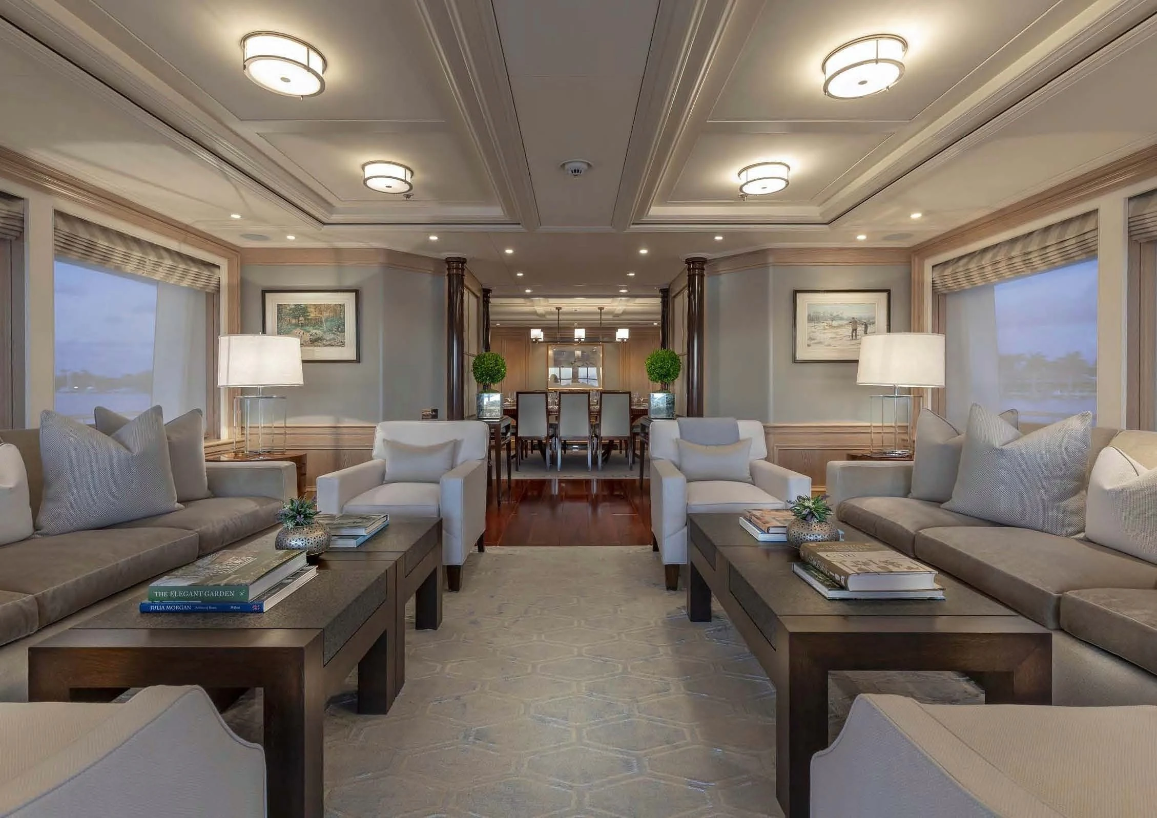 a living room with a large window aboard FABULOUS CHARACTER Yacht for Charter