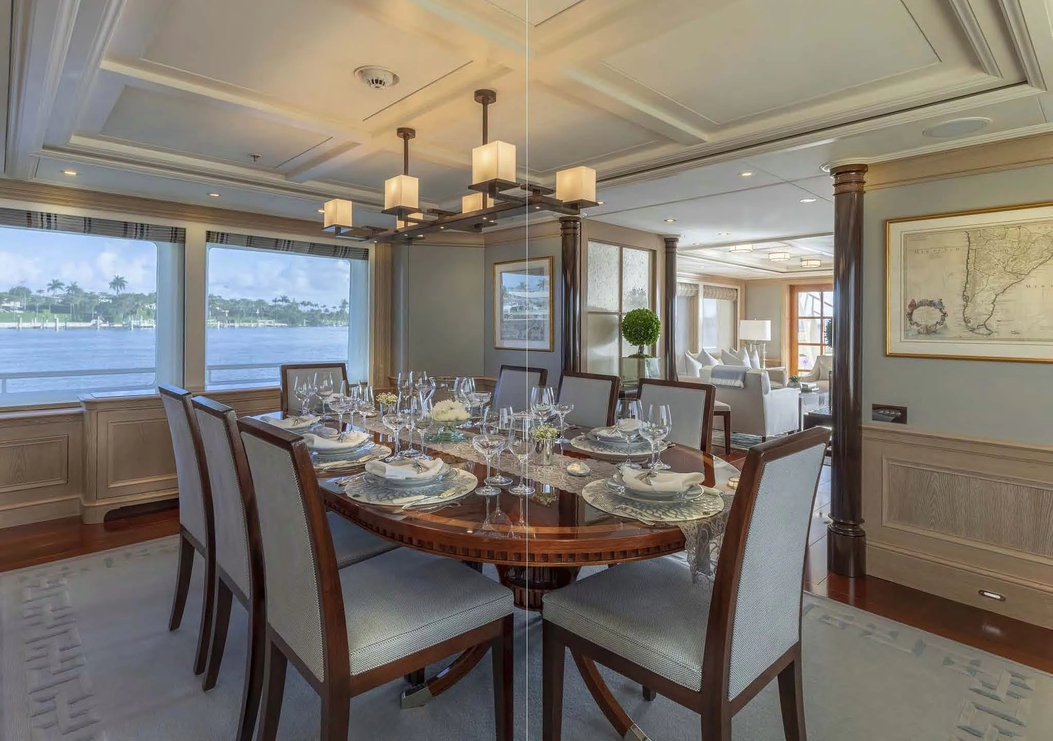 a dining room with a large window aboard FABULOUS CHARACTER Yacht for Charter