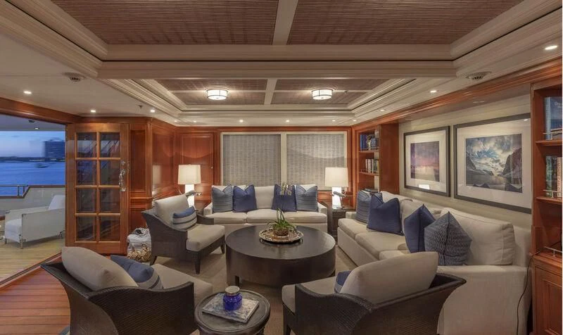 a living room with a large window aboard FABULOUS CHARACTER Yacht for Charter